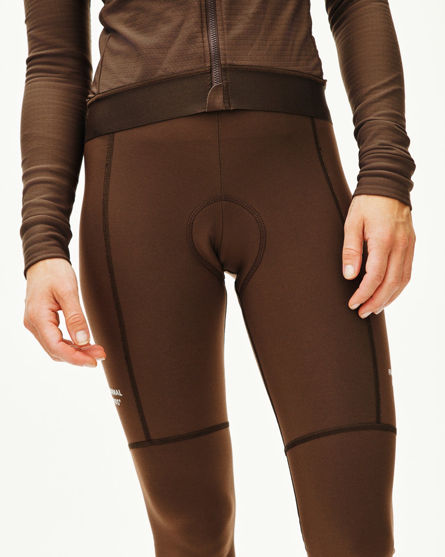 Brown thermal leggings with a focus on the design and fit.