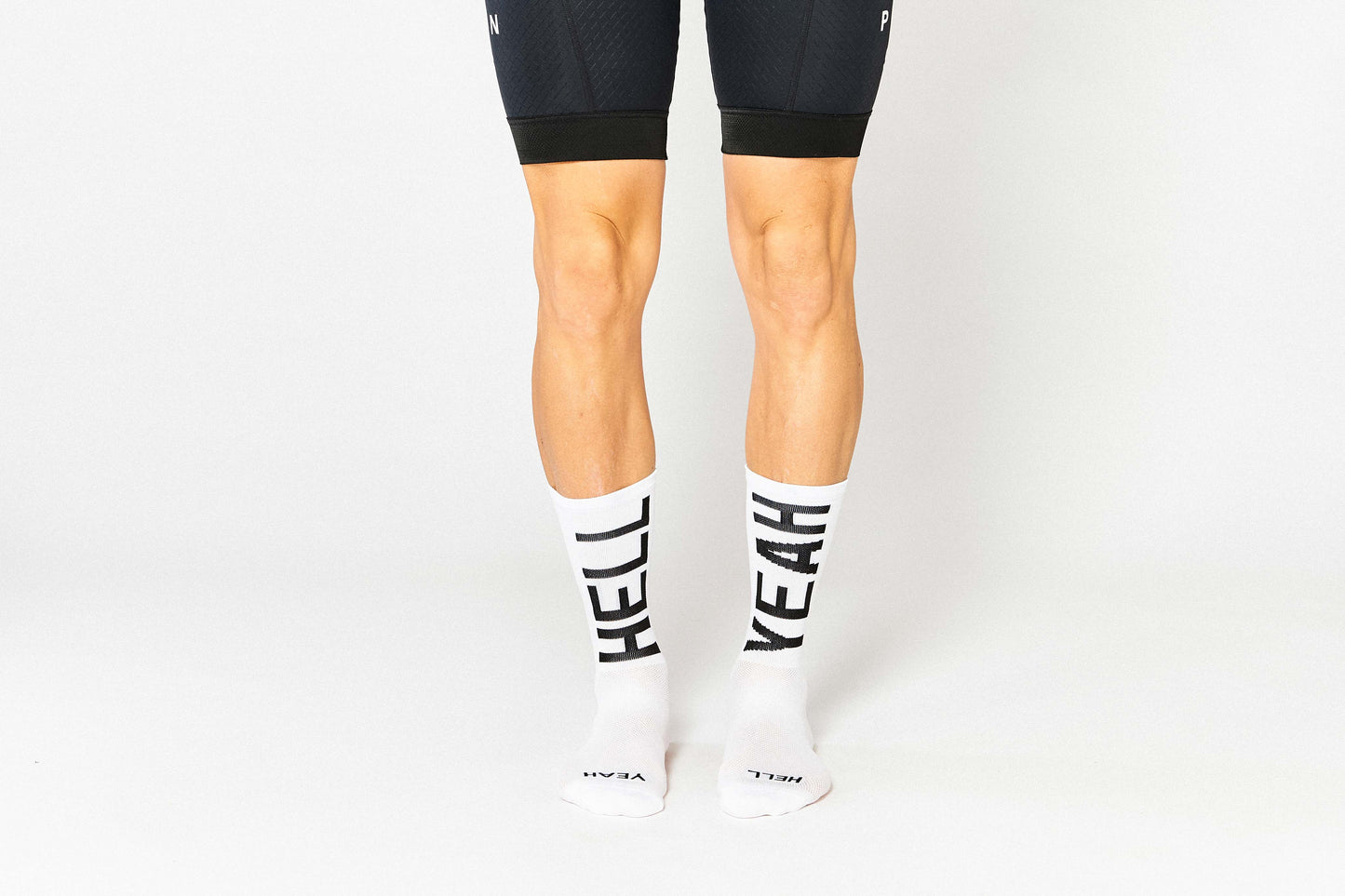 Hell Yeah 2.0 white socks, bold expression for cycling enthusiasts.