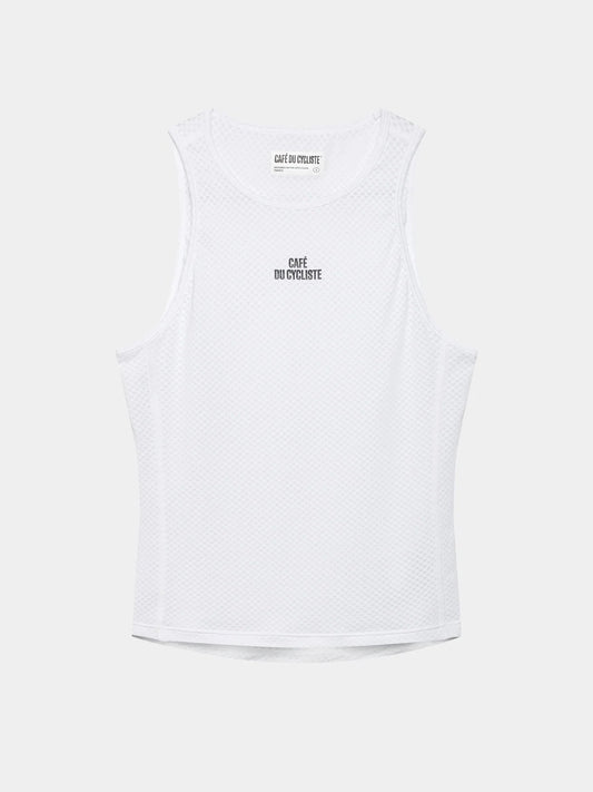 A white women's sleeveless base layer tank top with text on the chest.