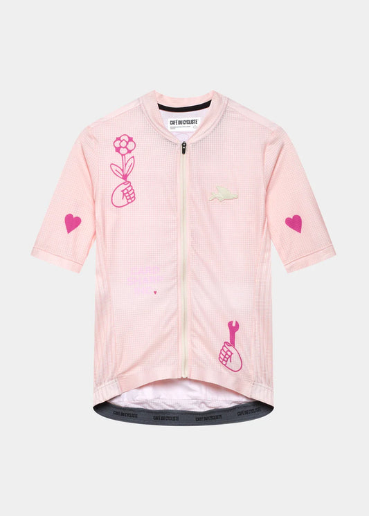 Women's short-sleeved cycling jersey in pink with heart and floral patterns, and mesh side panels.
