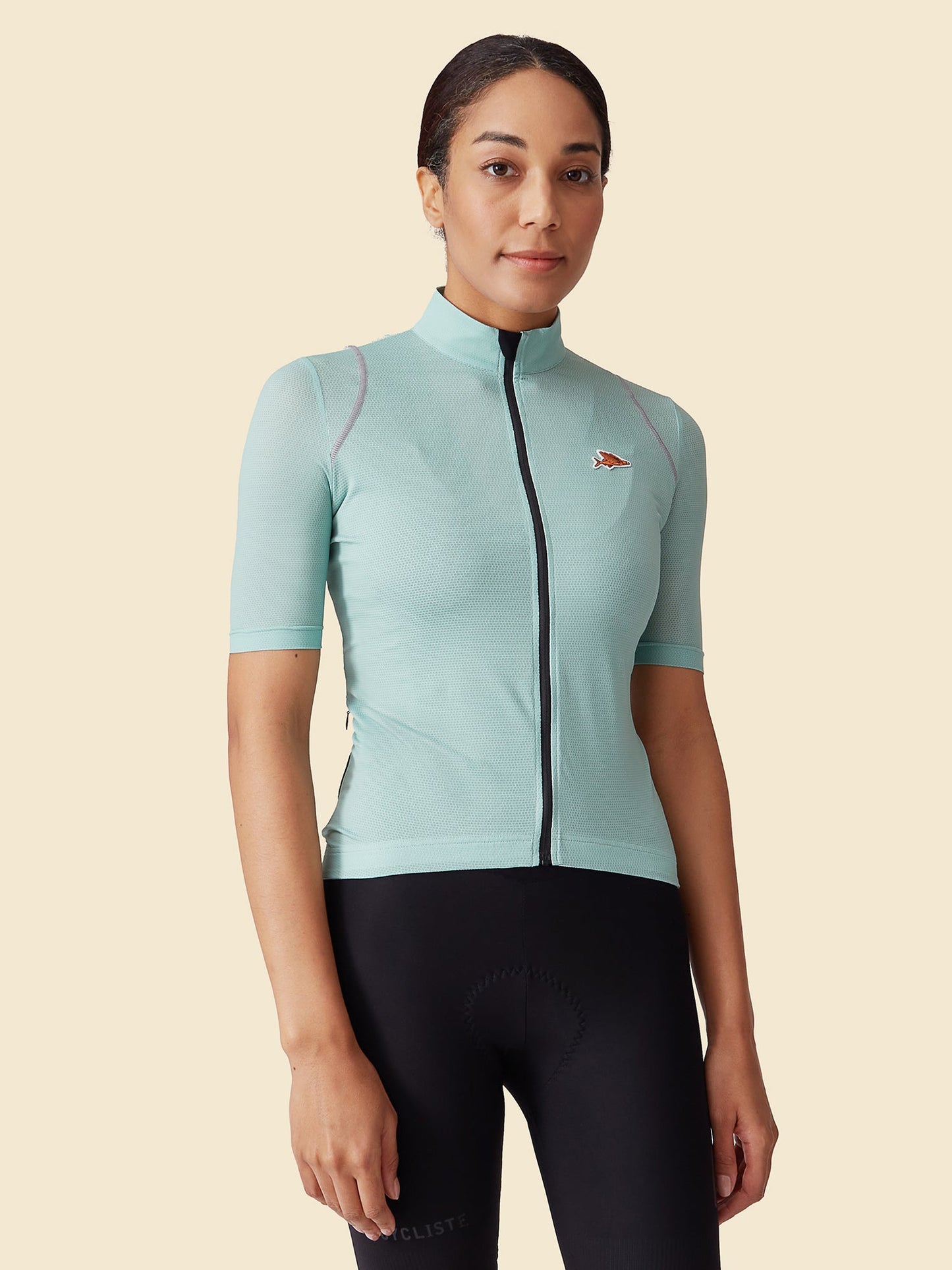 Front view of Women's Mona Jersey in Agave cassiopeia color, showing sleek design and short sleeves.