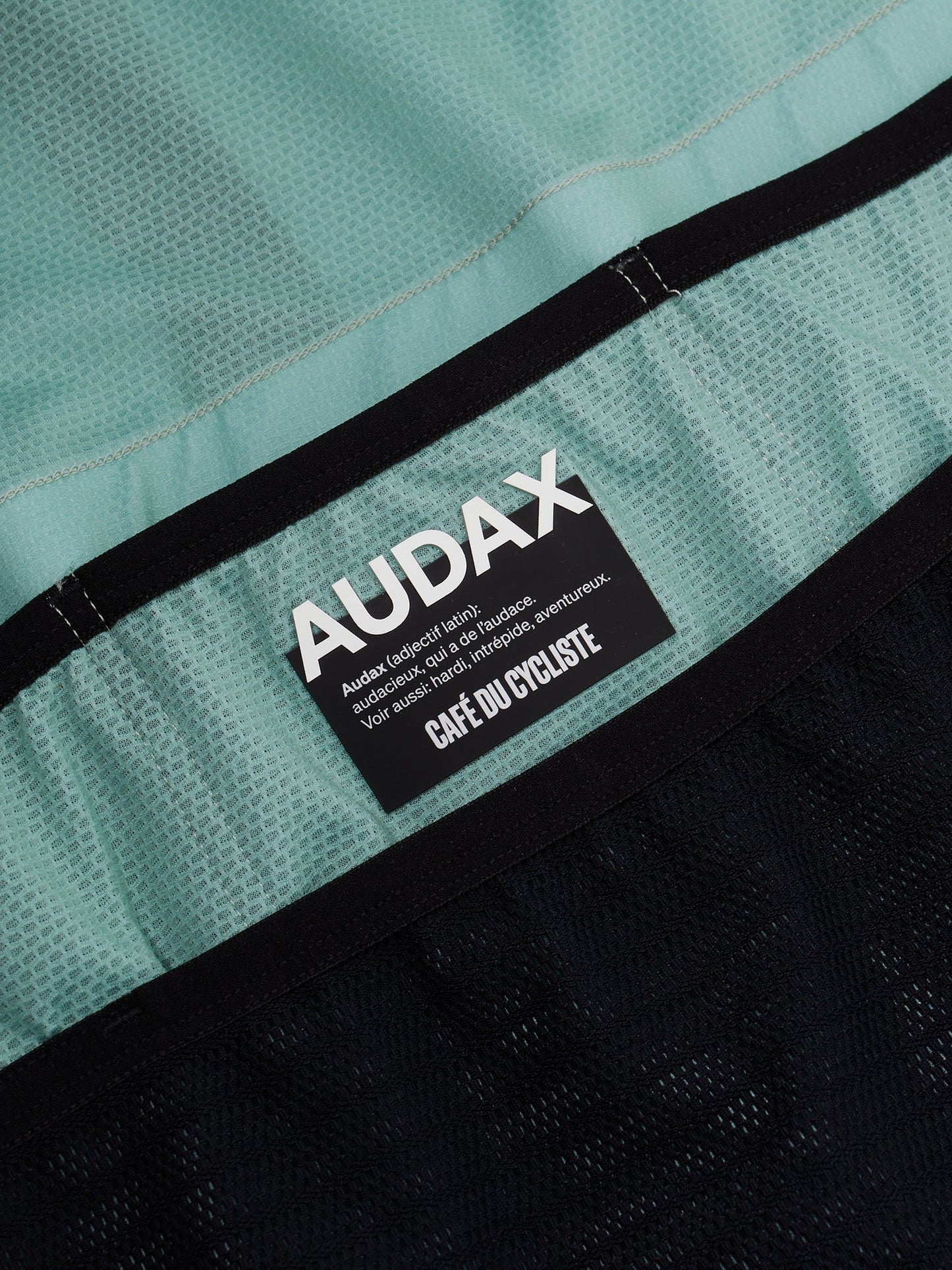 Folded Women's Mona Jersey in Agave cassiopeia showing the brand logo.