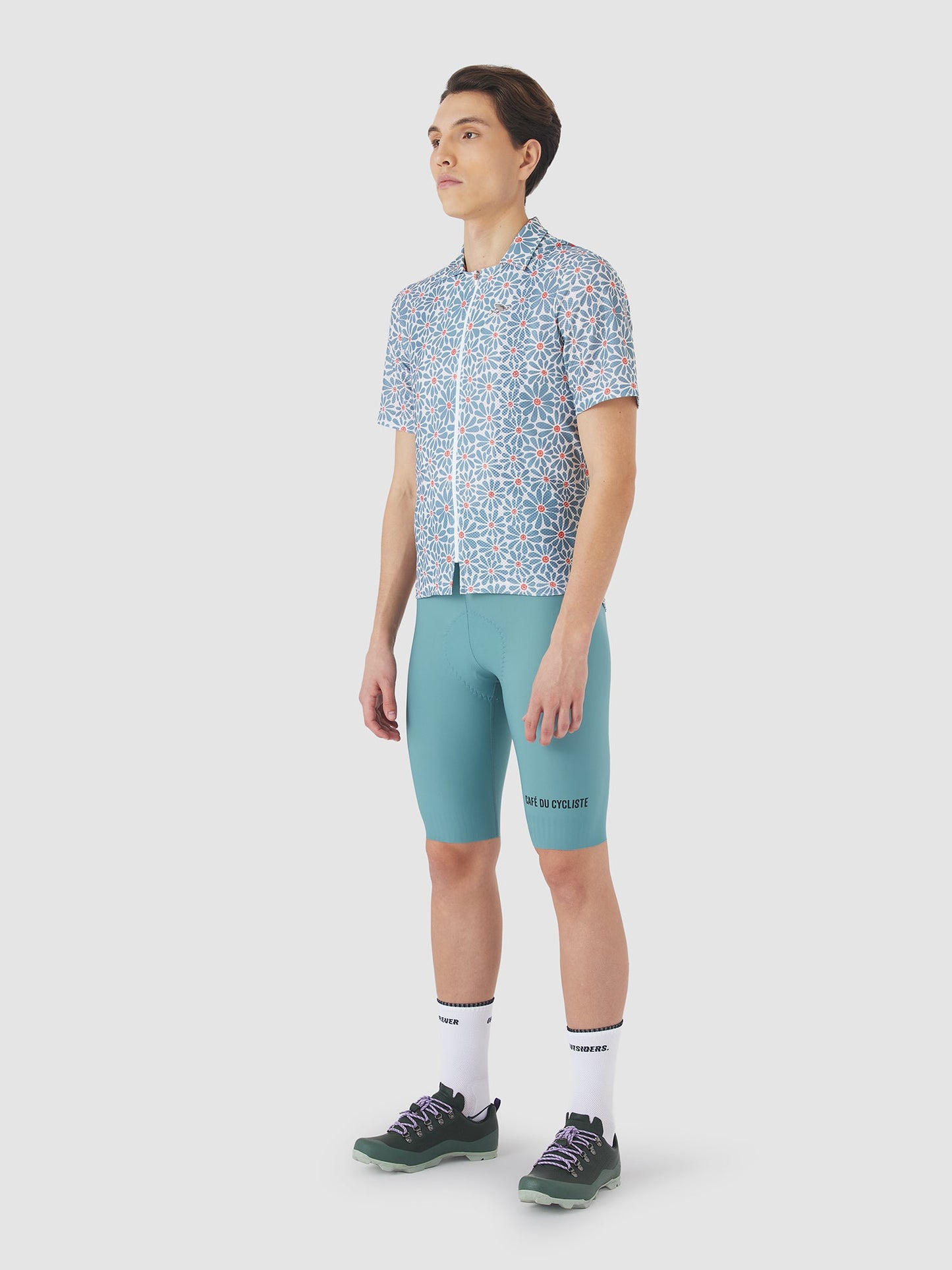 Side profile of Claudine Shirt in deep water blue with daisy motifs.
