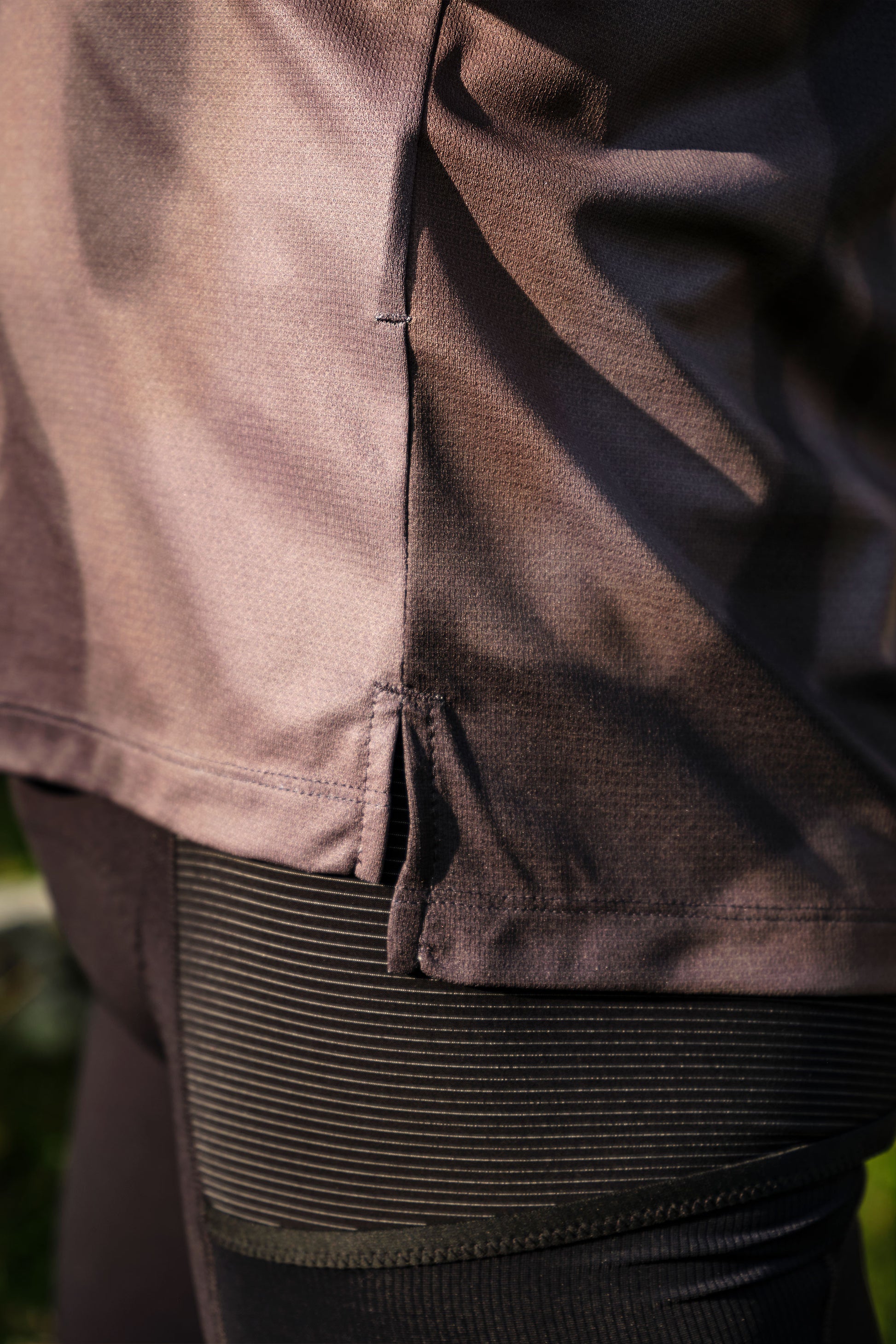 Close-up of stitching and hems on Beyond Gravel Tee Moonrock cassiopeia