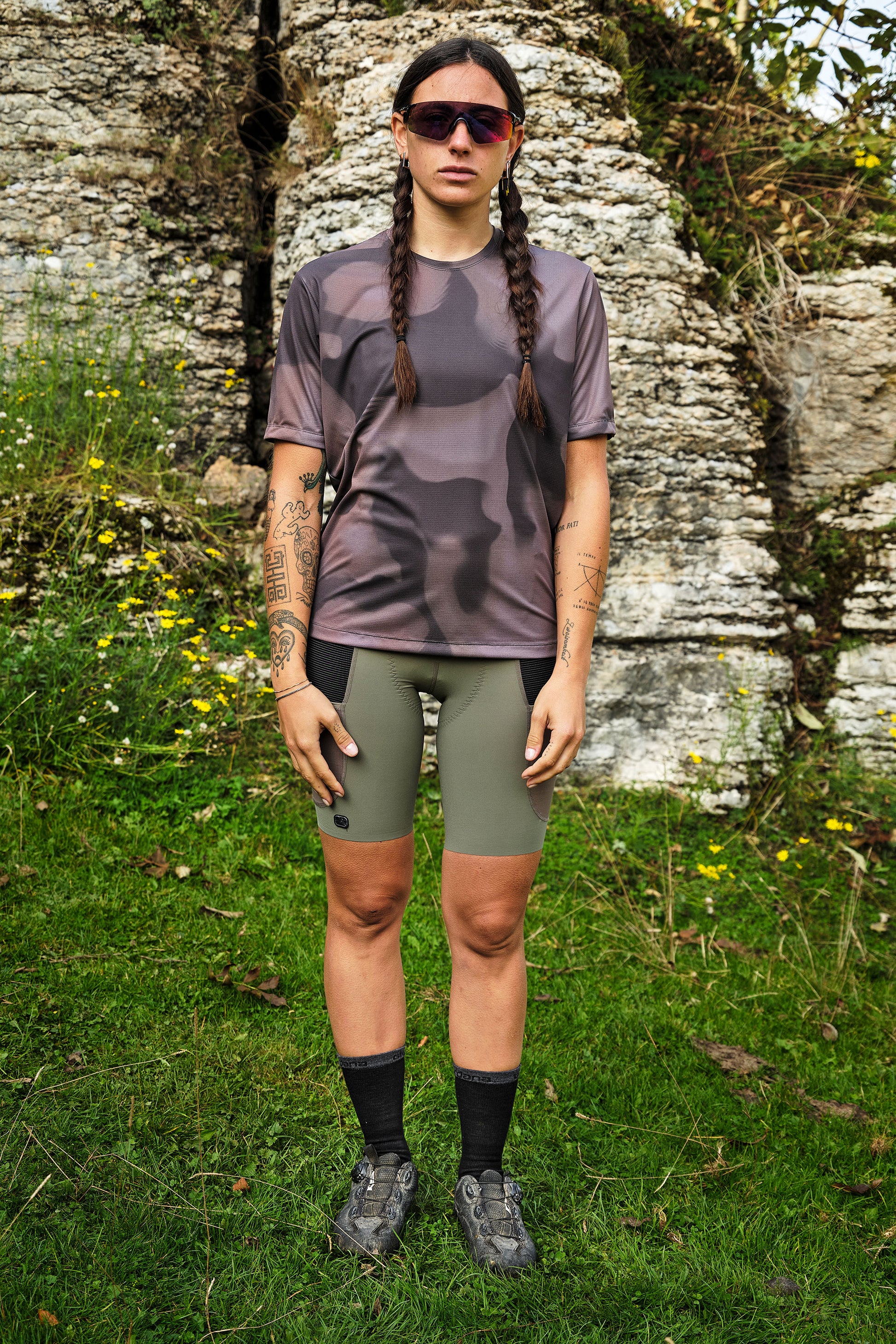 Beyond Gravel Tee Moonrock cassiopeia hanging on wooden hanger against white wall