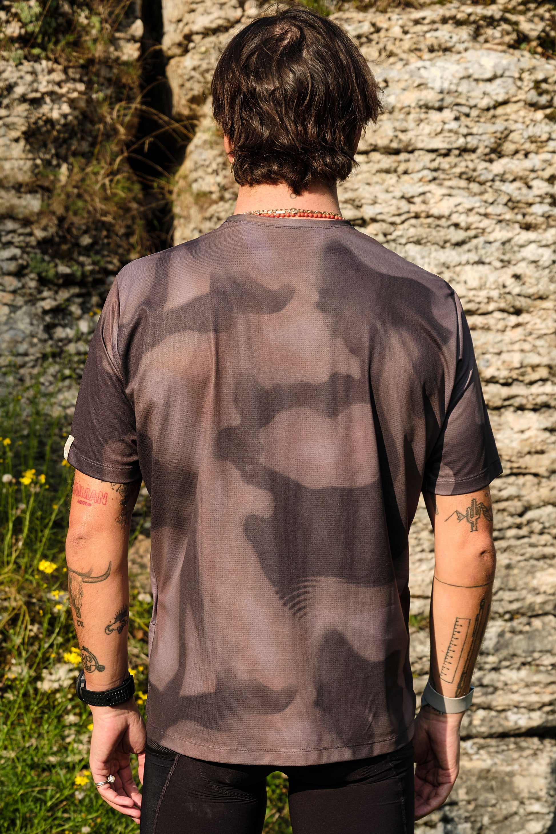 Close-up of stitching and hems on Beyond Gravel Tee Moonrock cassiopeia