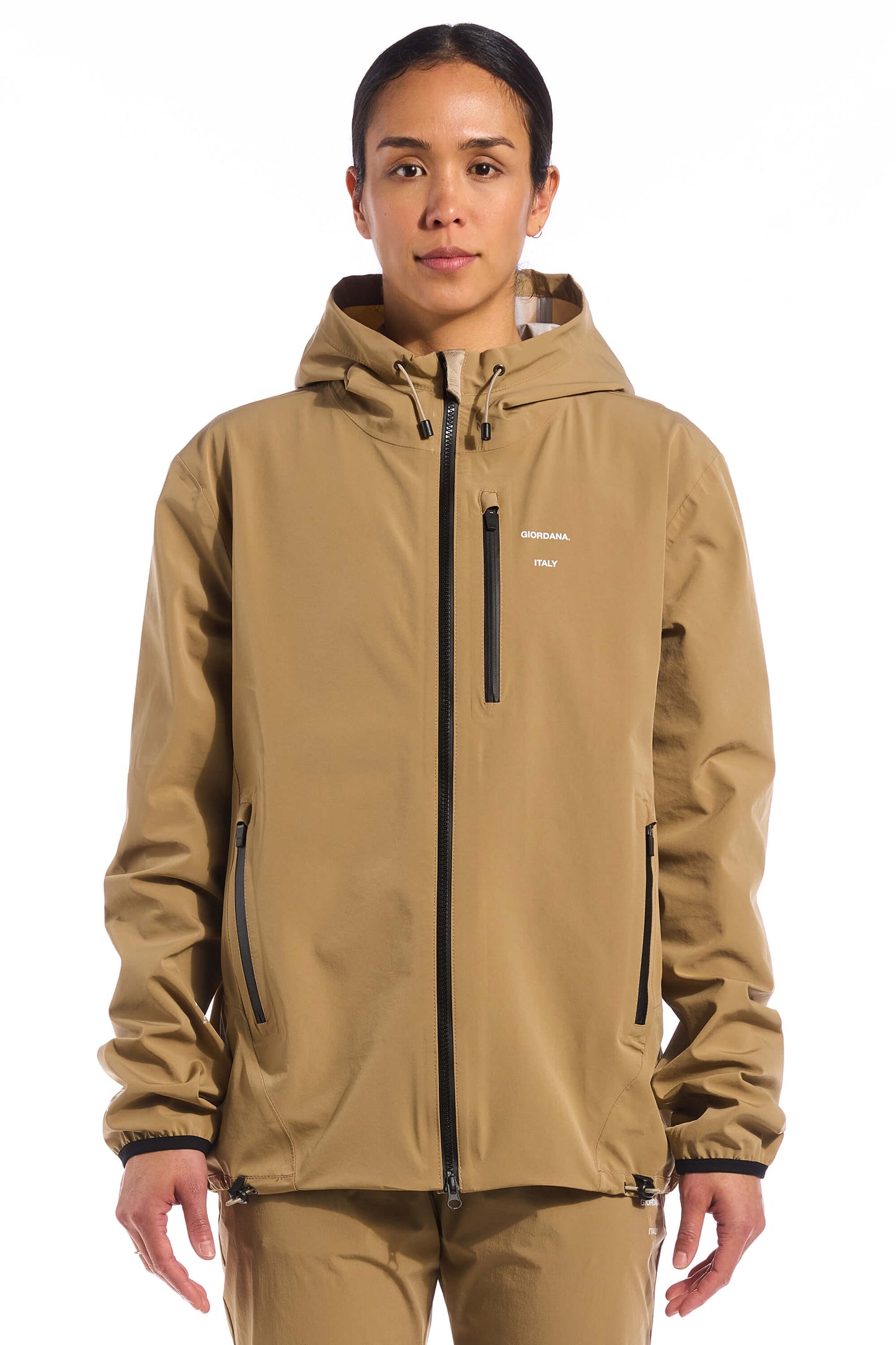 The KB Jetty Rain Jacket in Khaki, featuring a waterproof design perfect for every rider and every terrain in the Giordana x Kristopher Brock capsule collection, available on Cassiopeia US.