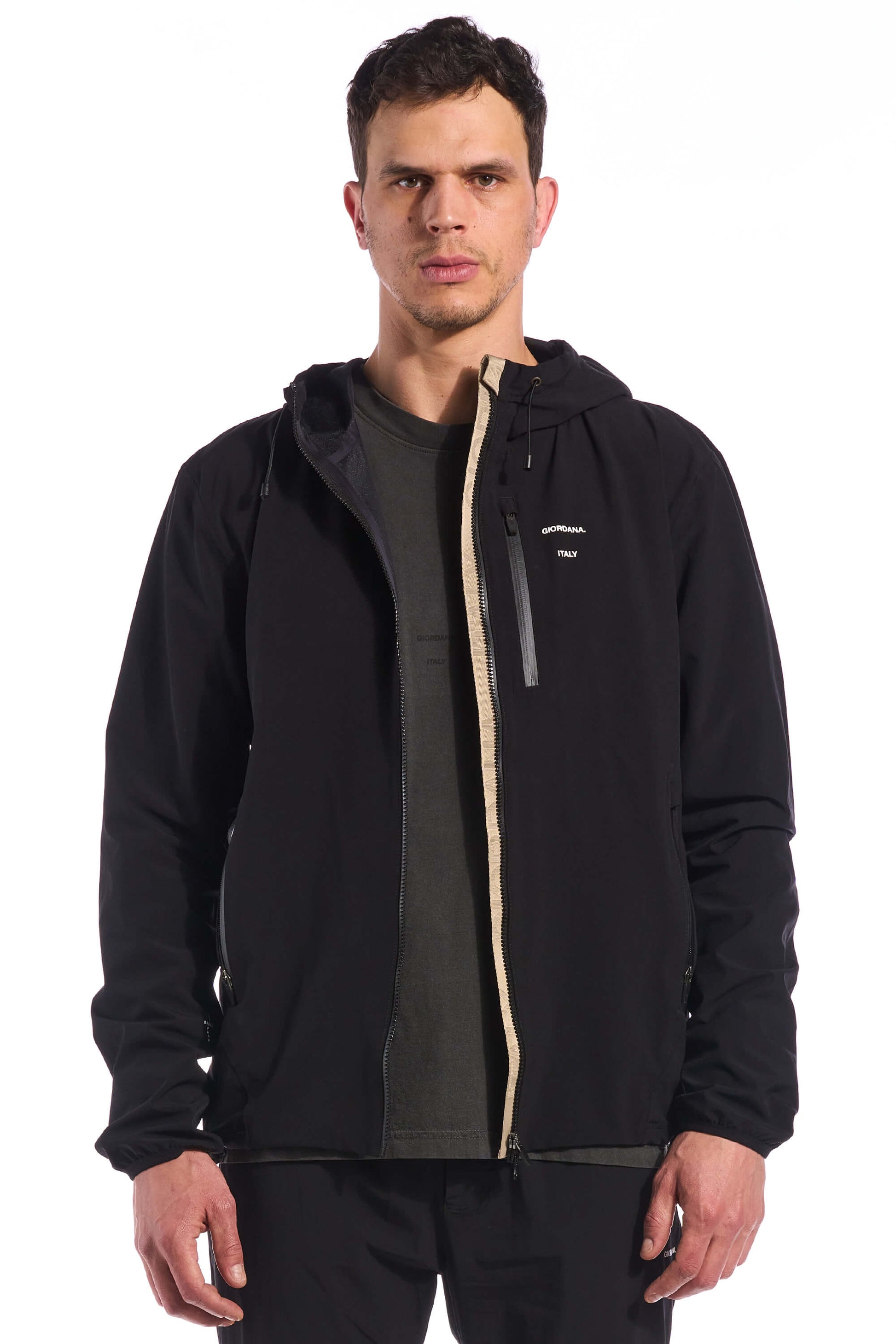 Image of the front chest pocket on the Meteorite Black Jetty Rain Jacket, designed for convenient storage while cycling or exploring outdoors, available on Cassiopeia US.