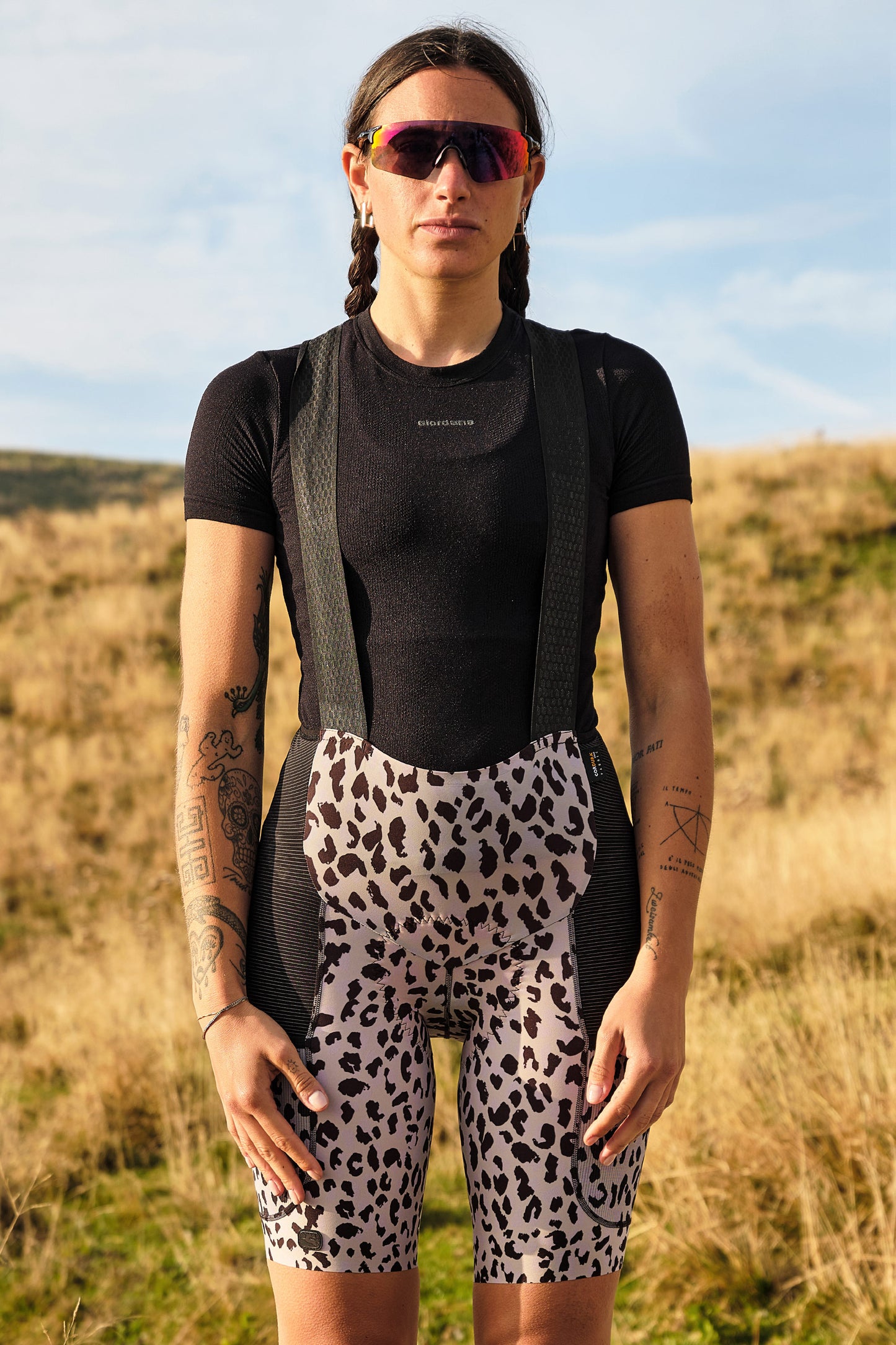 Beyond Gravel Cargo Bib Shorts in Leopard, ideal for rugged adventures on unpaved trails.