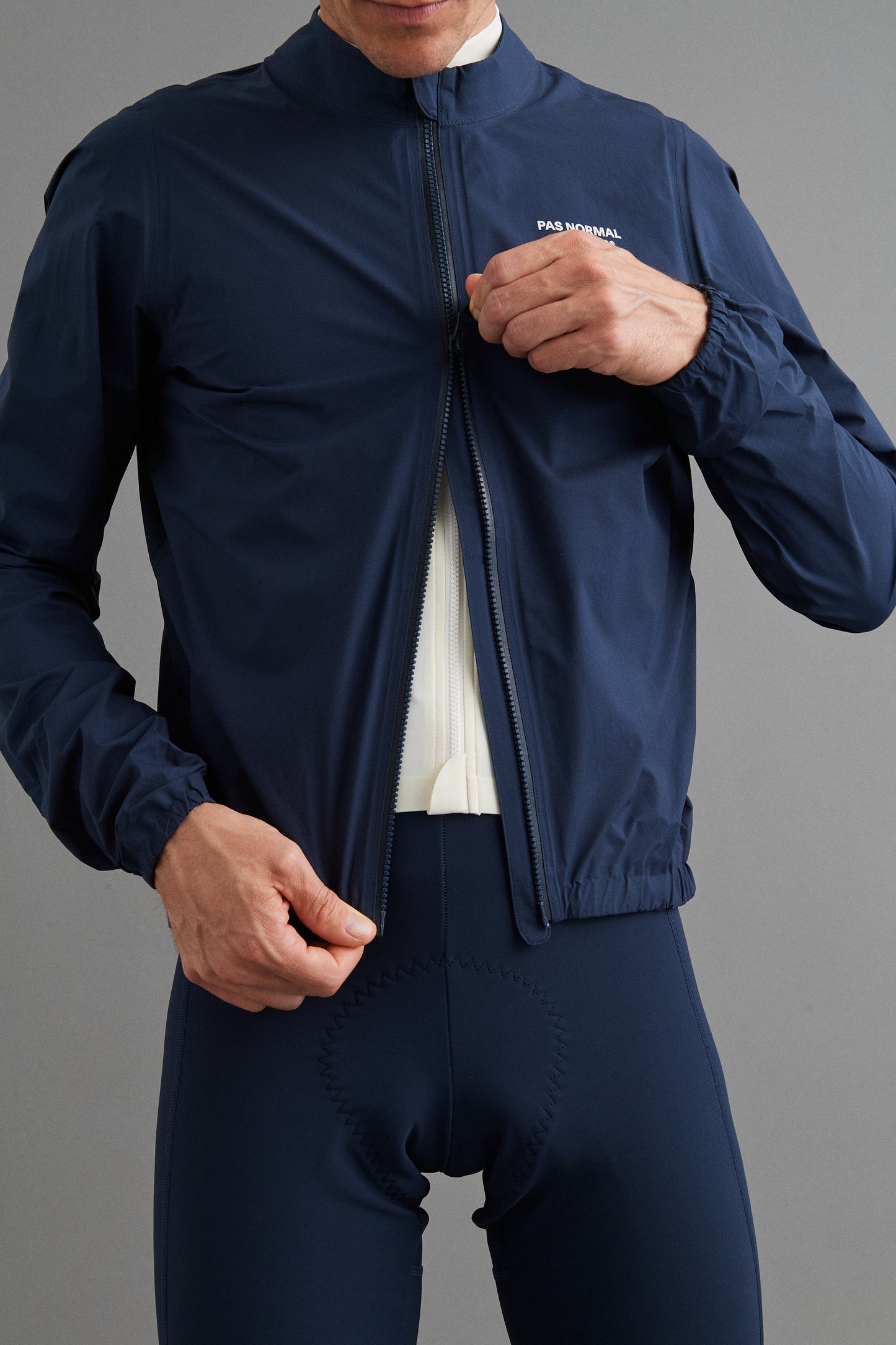 Close-up of Men's Mechanism Pertex Rain Jacket Navy two-way waterproof zipper for easy access