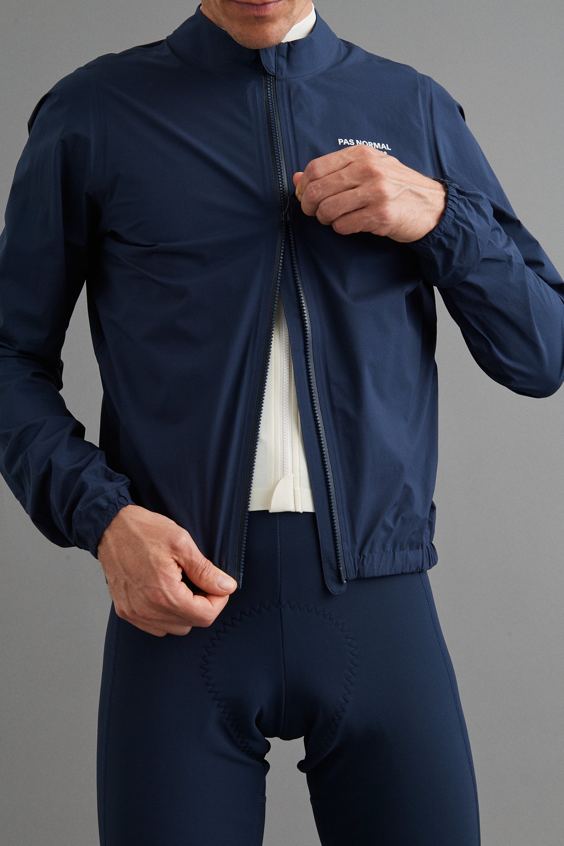 Close-up of Men's Mechanism Pertex Rain Jacket Navy two-way waterproof zipper for easy access