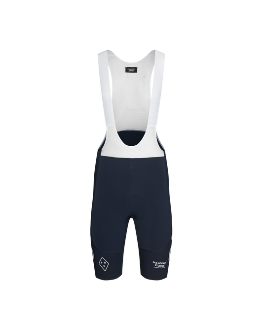 Men's navy blue bib shorts with white straps and detailing, designed for cycling.
