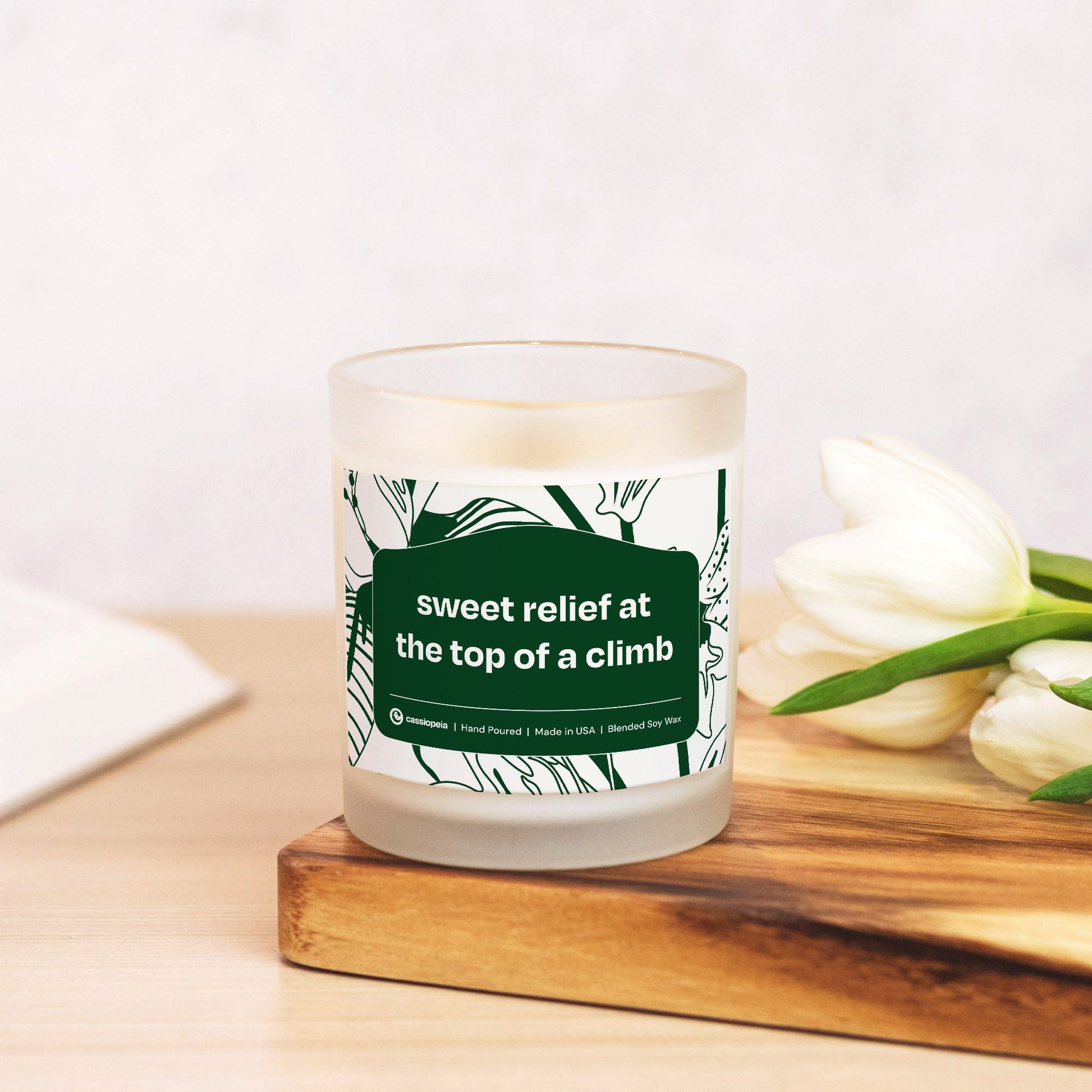 Sweet Relief at the Top of a Climb candle, natural off-white with a fresh scent.