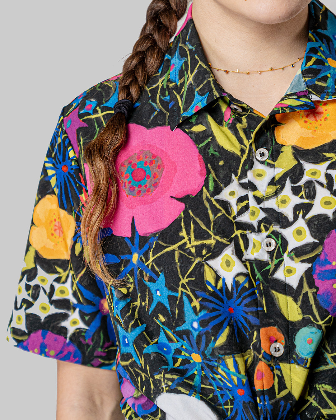 Vibrant Fiori Notturni Resort Shirt showcasing a floral pattern inspired by night blooms, crafted for breathability and comfort during summer rides, available on Cassiopeia US.