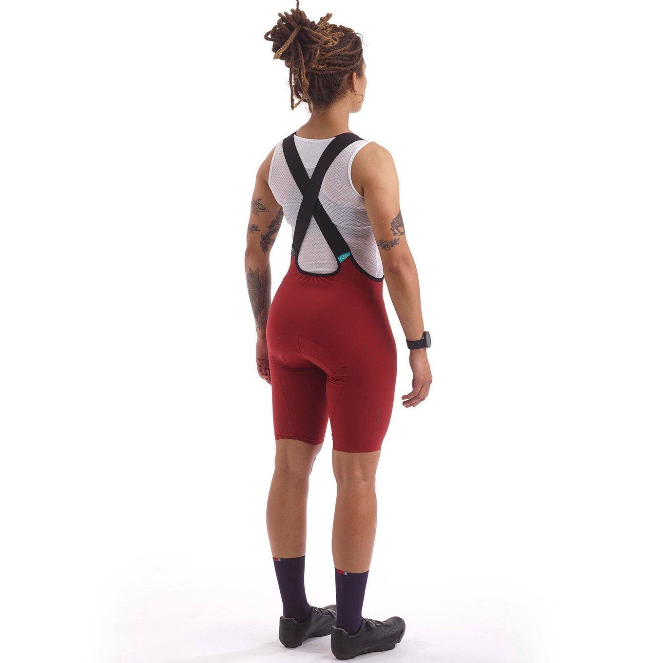 Cassiopeia LUXE Bib Shorts in Oxide Red, offering superior compression and comfort for cycling athletes.