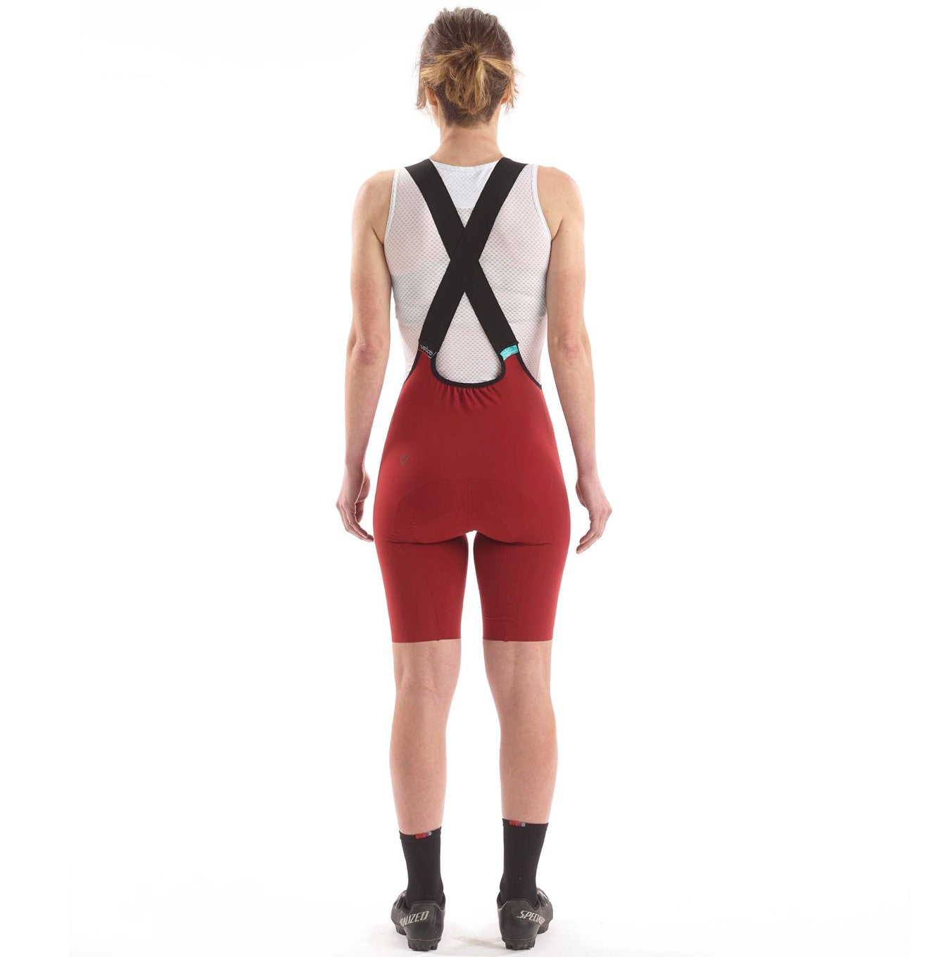 Cassiopeia LUXE Bib Shorts in Oxide Red, designed with minimal seams for optimal on-bike performance.