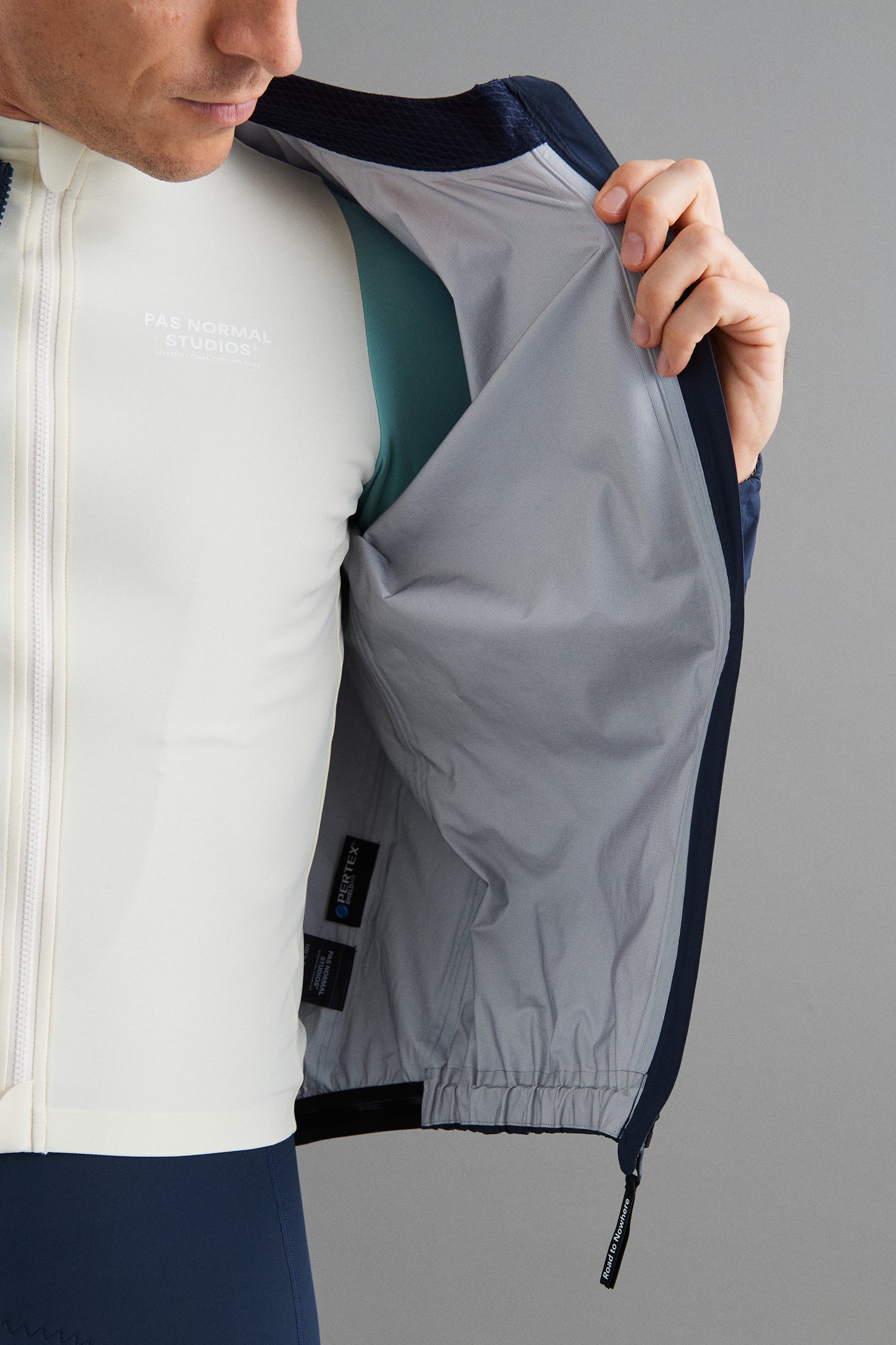 Front view of Men's Mechanism Pertex Rain Jacket Navy showcasing its sleek inner design