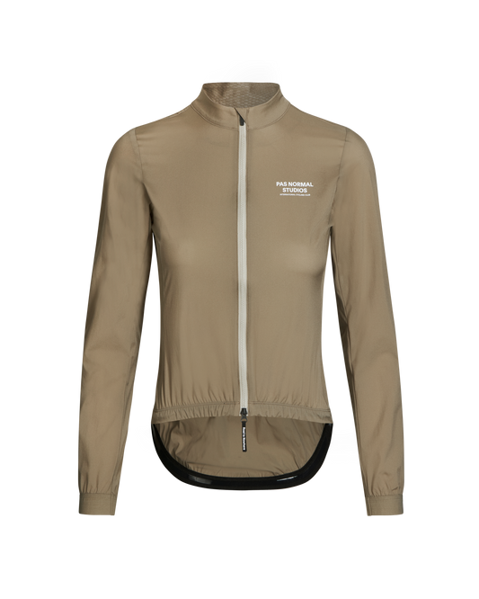 Women's Mechanism Stow Away Jacket - Beige by PAS NORMAL STUDIOS, showcasing lightweight, packable design and DWR-treated fabric.
