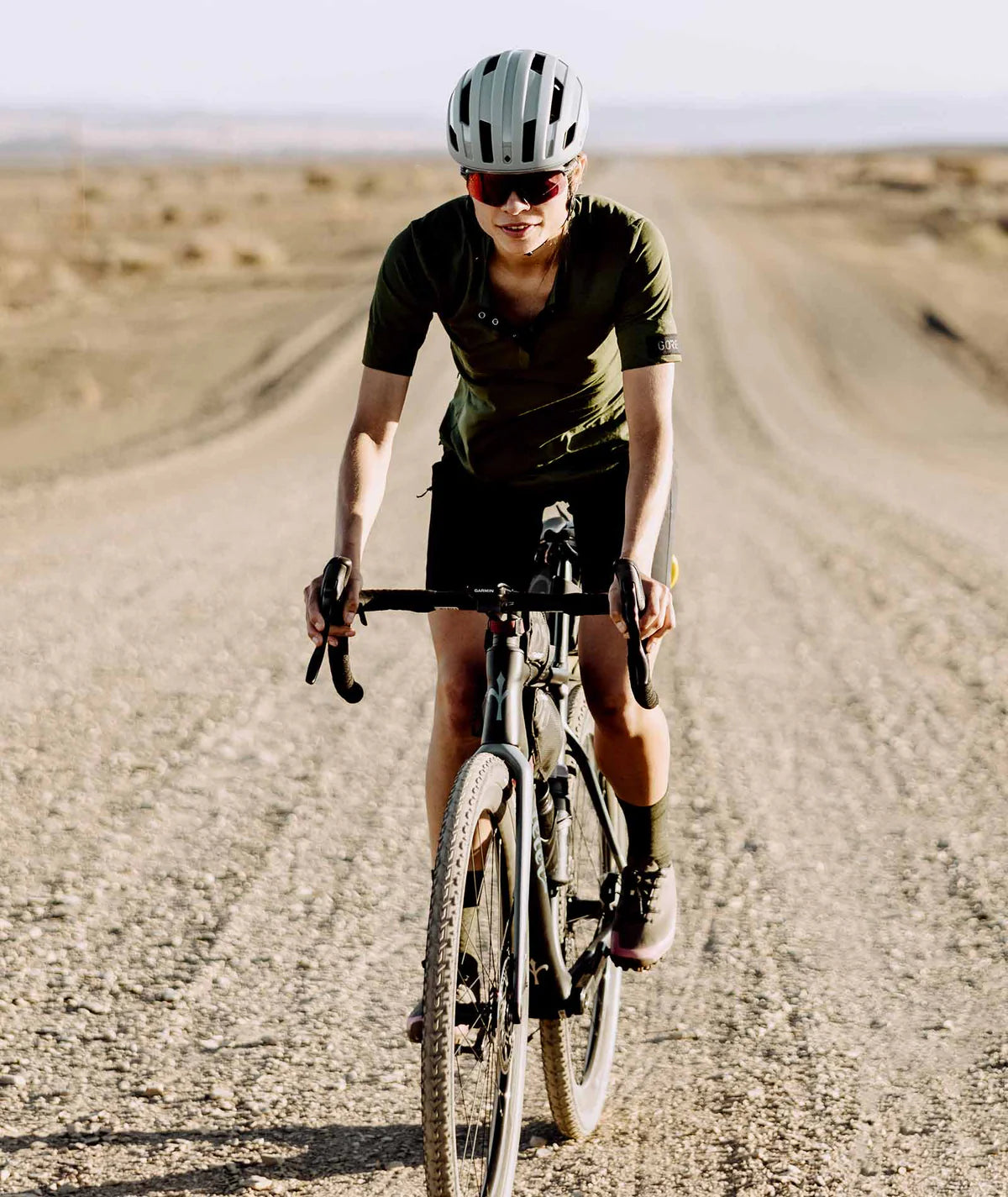 a women cyclist wearing Quoc Gran Tourer Lace - Pink