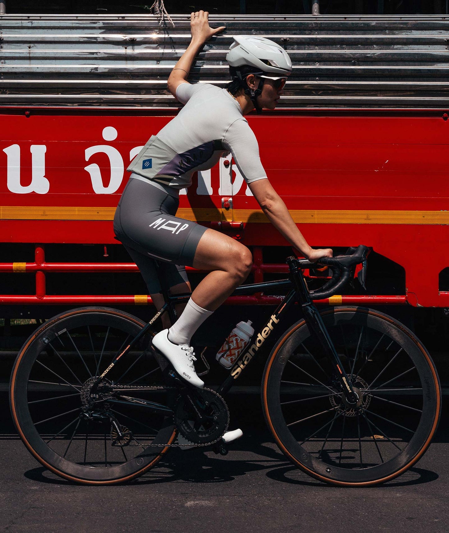 Durable white cycling shoes featuring a reinforced toe guard and easy-to-clean premium material for added protection.