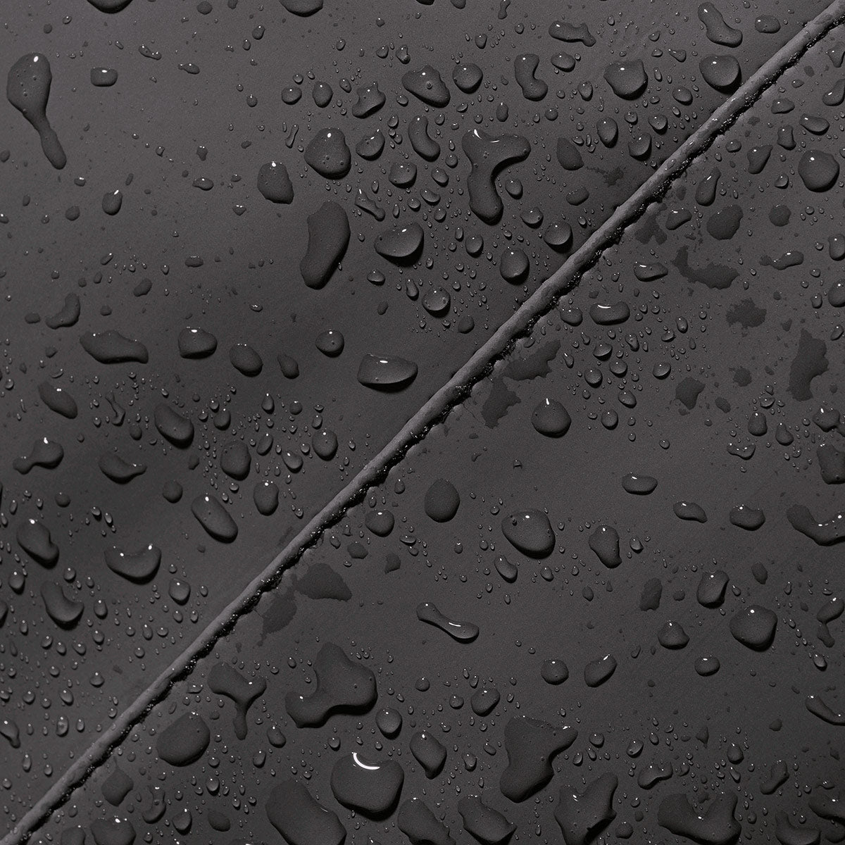 Durable crossbody bag in Black, waterproof fabric for protection in any weather.