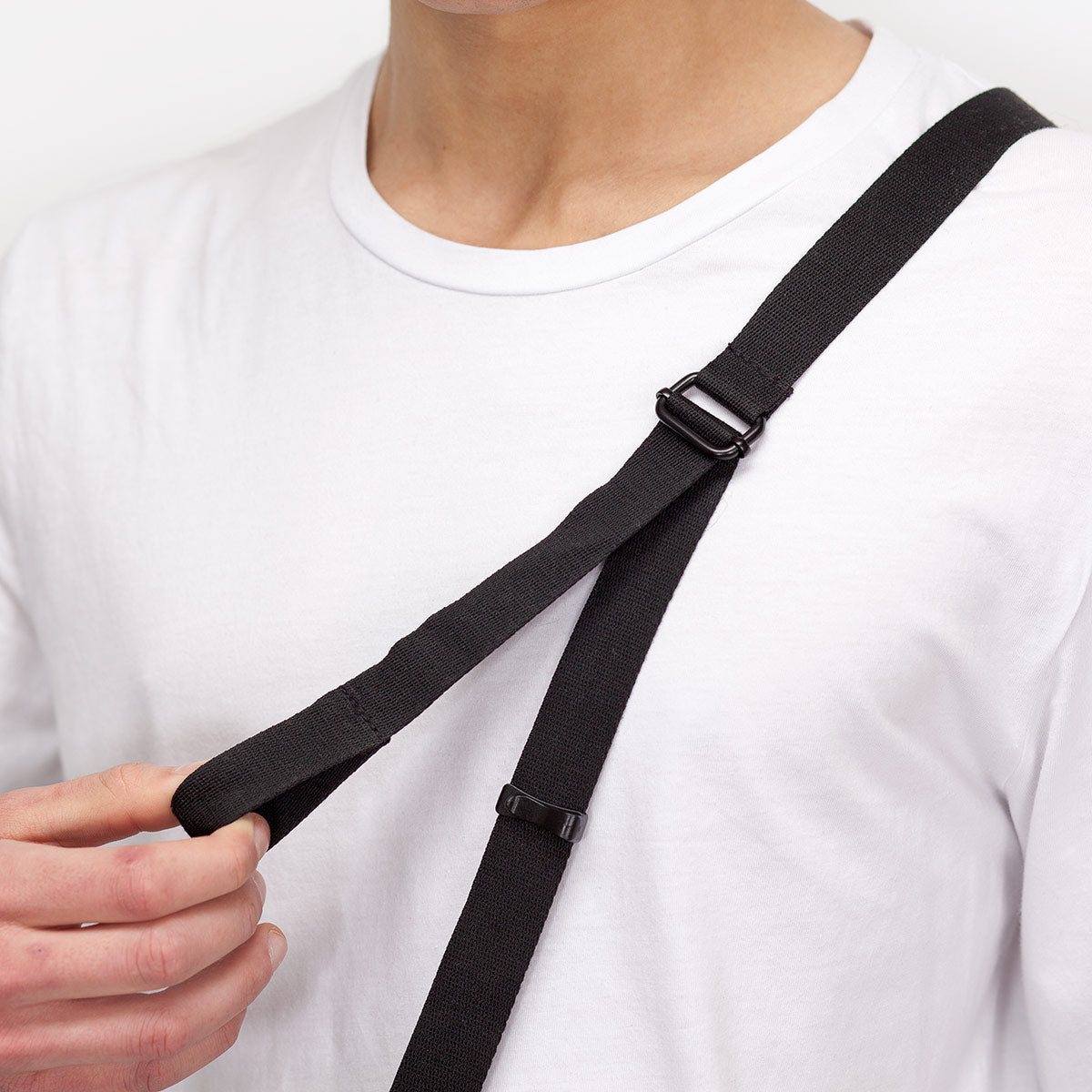 Sleek Black Jona crossbody bag, designed for convenience and style on every ride.