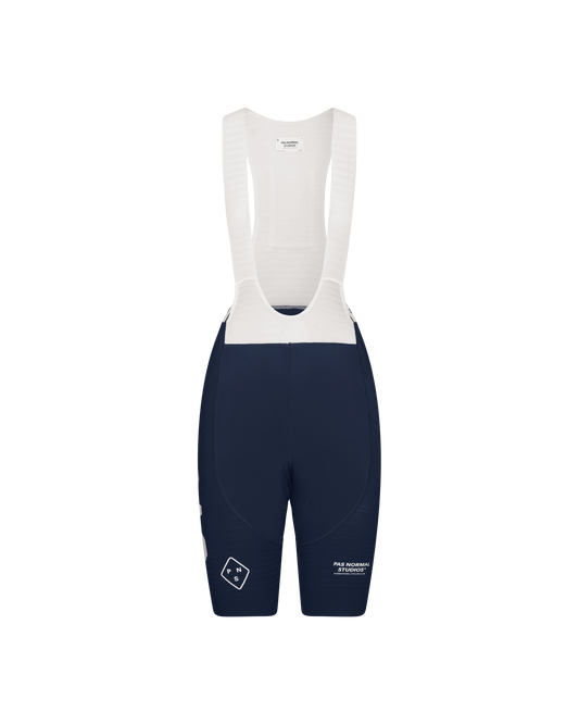 Women's navy blue bib shorts with white straps and a white and blue logo on the left thigh area.