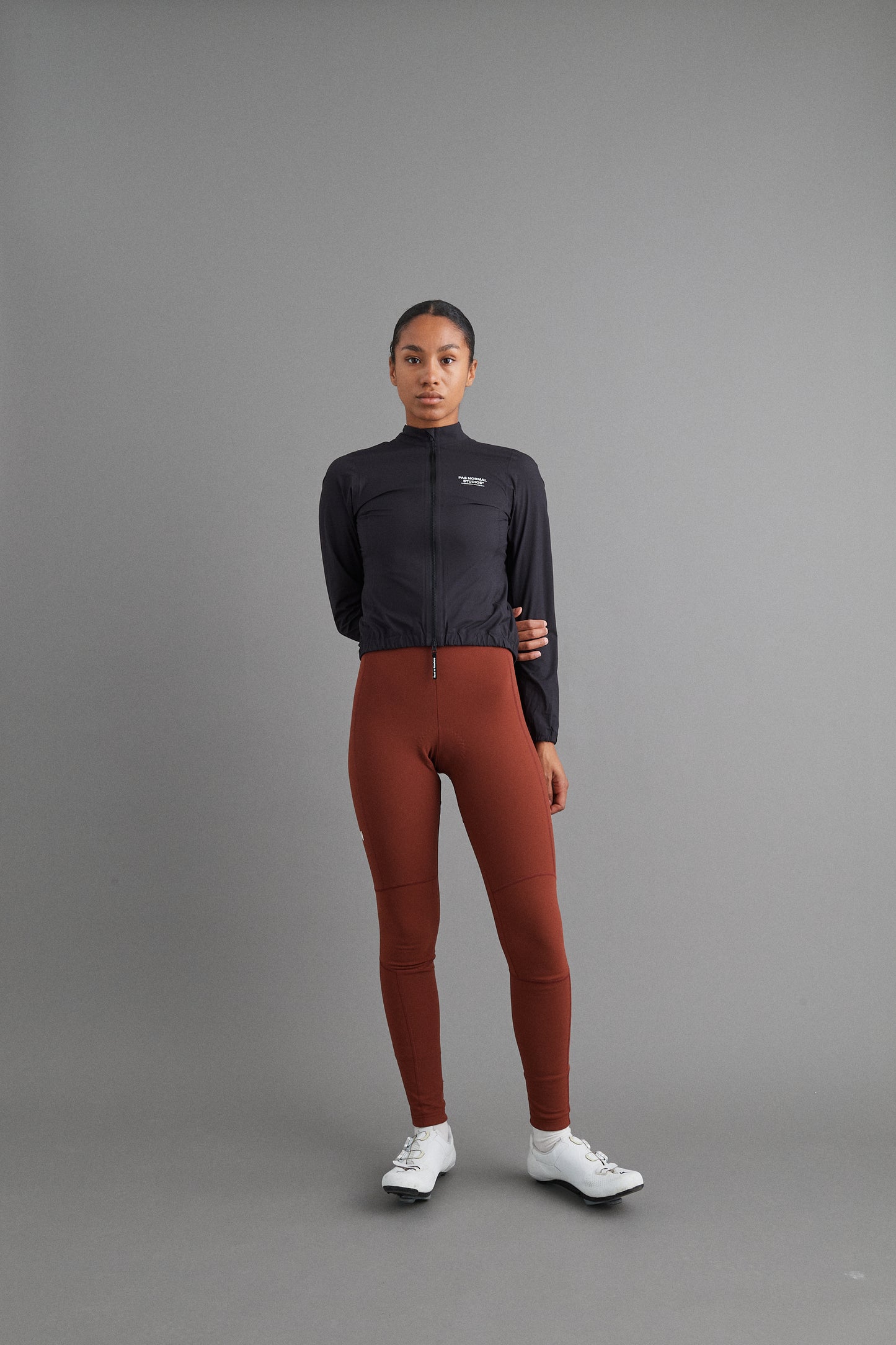 Front view of Women's Mechanism Rain Jacket Black showcasing on model its sleek waterproof design