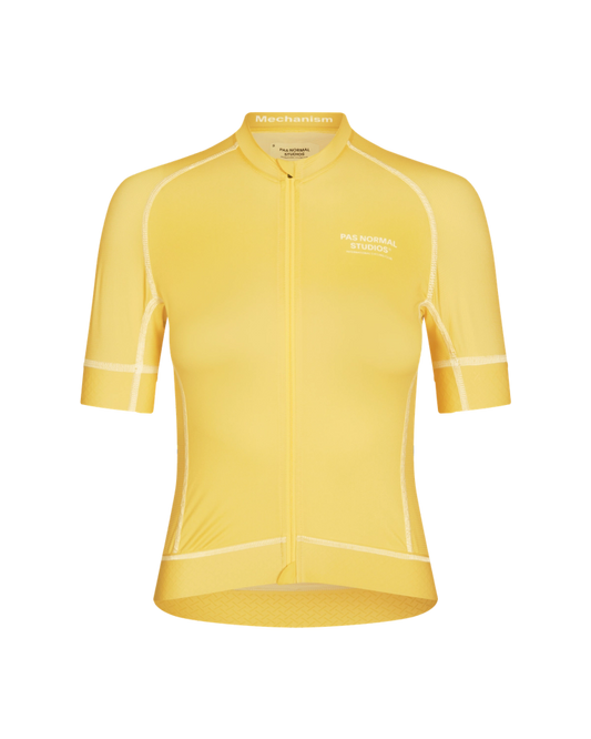 A women's dusty yellow cycling jersey with short sleeves and a round neckline.
