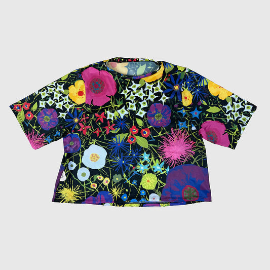 Colorful floral-patterned shirt on a white background