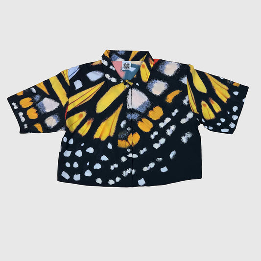 Short-sleeve shirt with butterfly pattern on a light gray background