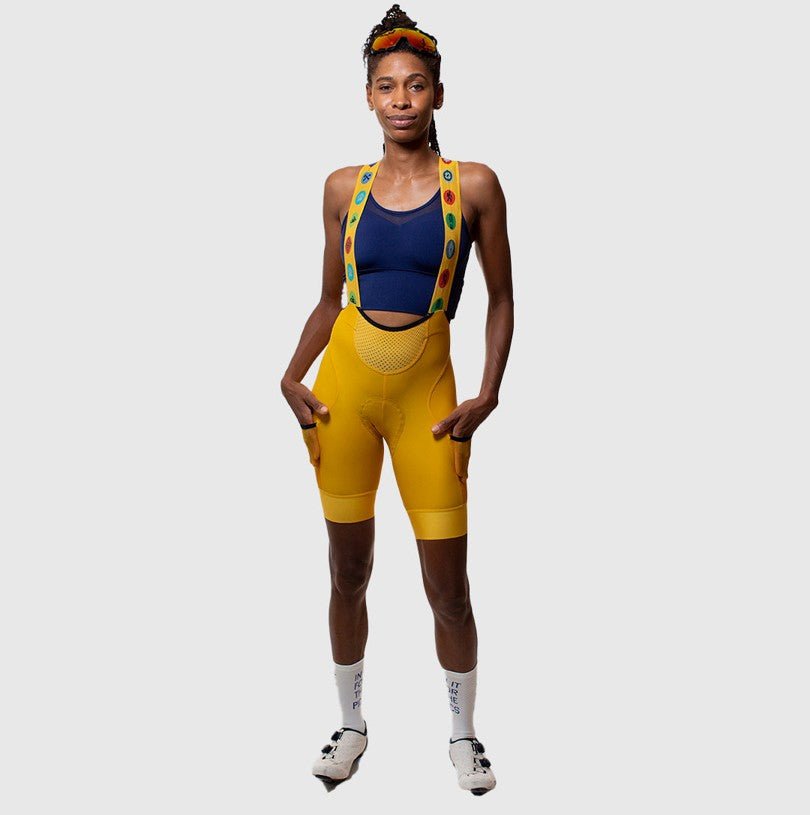 Cassiopeia cargo bibs with retro-reflective details, camping badges, silicone leg grippers