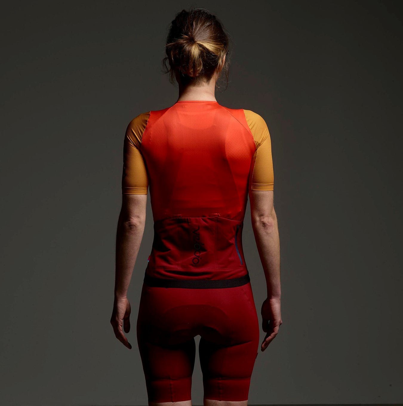 Stand out with the vibrant fire red Cassiopeia Concept SE Jersey, perfect for passionate cyclists.