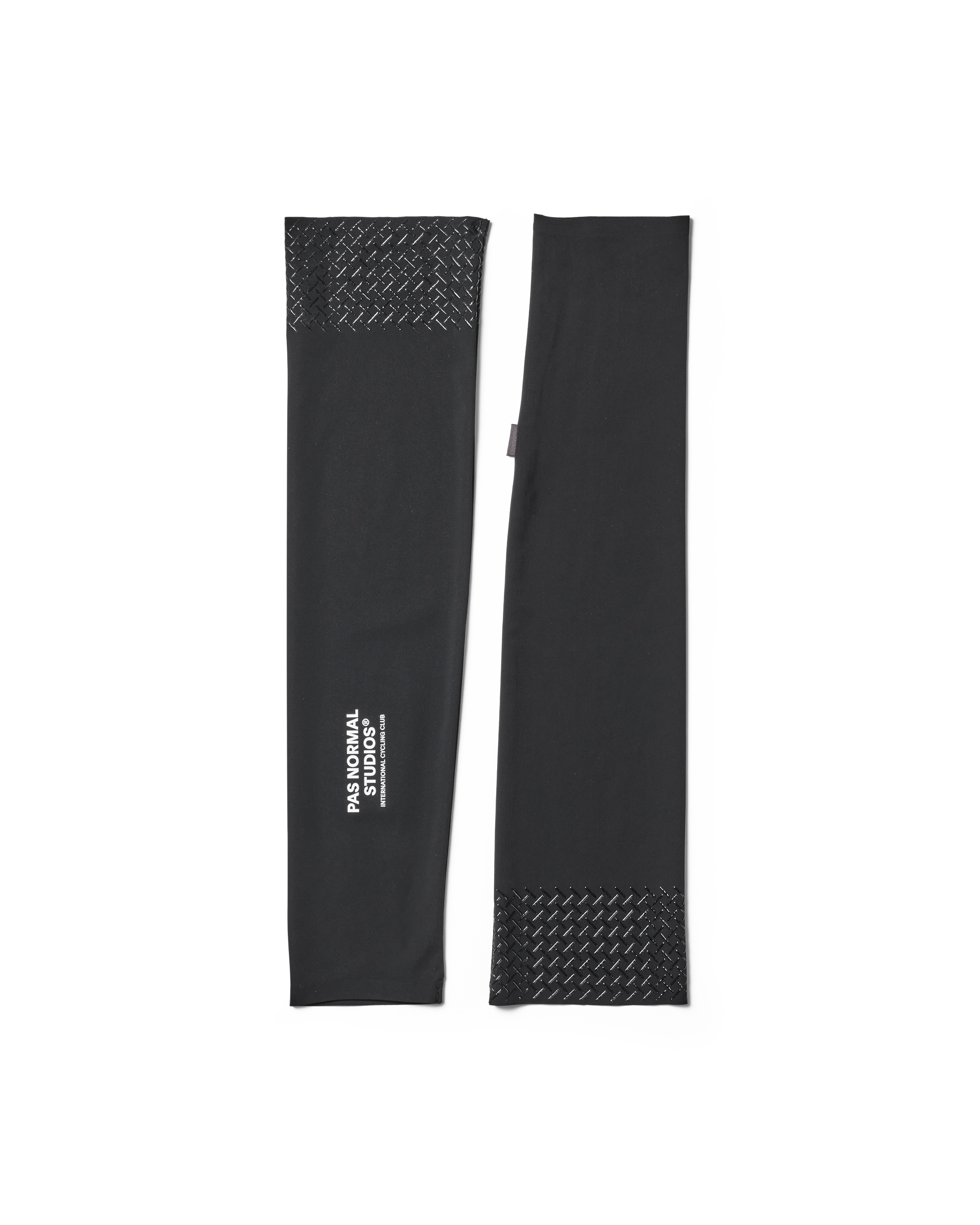Black arm sleeves with textured ends on a white background