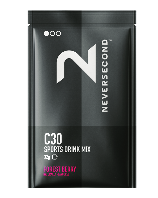 Black package of Never Second C30 Sports Drink Mix with forest berry flavor on a white background