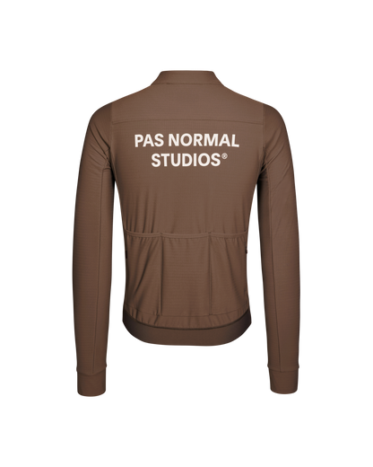 Brown jacket with 'Pas Normal Studios' logo on the back against a white background