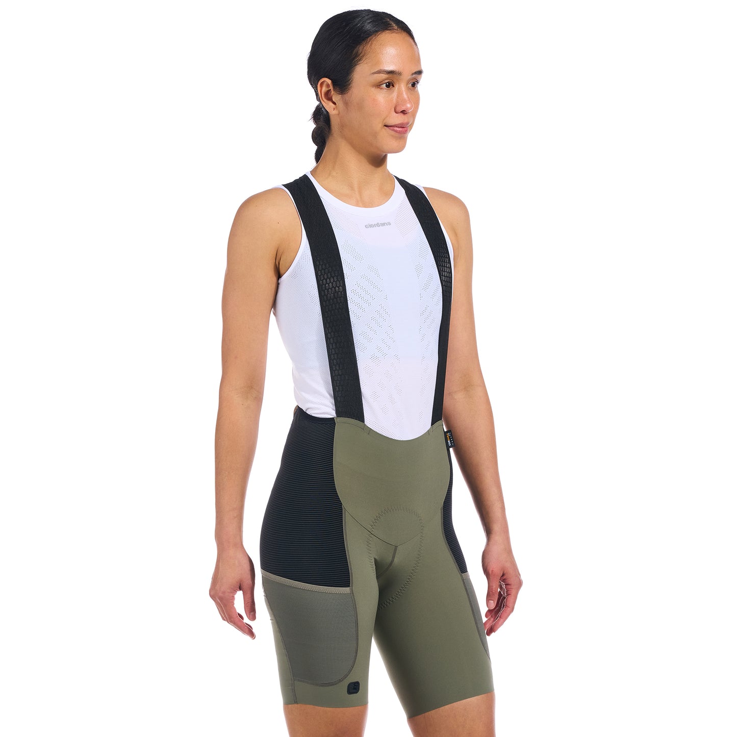 Beyond Gravel Cargo Bib Shorts in Olive, designed for adventurous cycling on unpaved trails.
