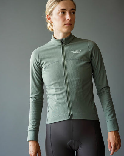 Versatile Women's Essential Thermal Long Sleeve Jersey in a rich Dark Celeste hue, ideal for layering during chilly cycling excursions. Available at Cassiopeia US.