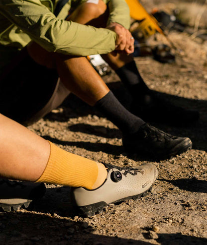 Resilient sand biking shoes equipped with a reinforced toe guard to protect against impact and abrasion.
