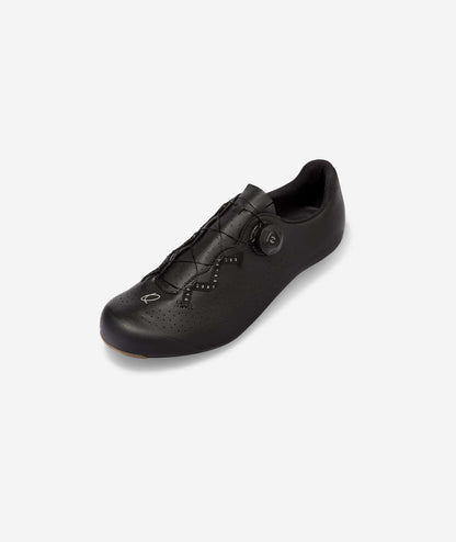 QUOC High-performance cycling shoes featuring a carbon composite outsole that balances stiffness and comfort for long rides.
