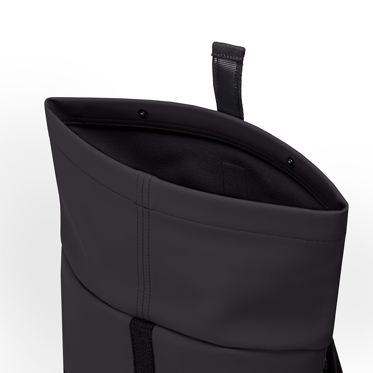 Close-up of the Hajo Backpack's roll-top closure and hook-and-loop fastener.

